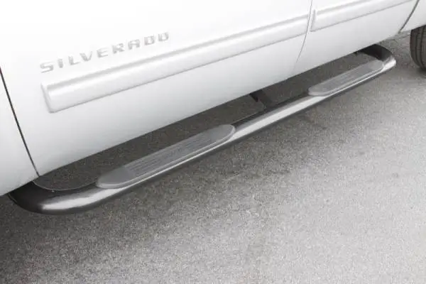 Lund 99-13 Chevy Silverado 1500 Ext. Cab (Body Mount) 4in. Oval Curved SS Nerf Bars - Polished